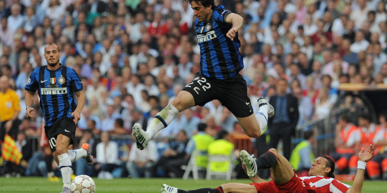Diego Milito rides a challenge from Martin Demichelis in the 2010 Champions League Final