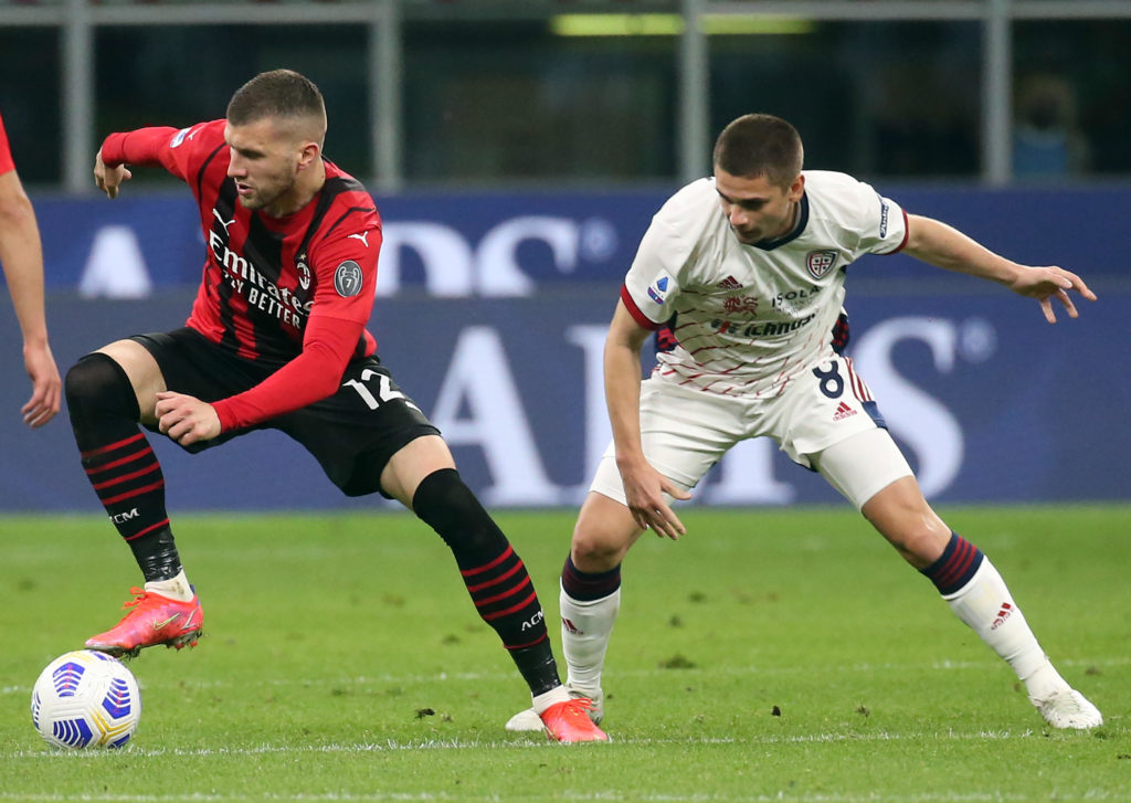 Cagliari's Razvan Marin challenges Milan's Ante Rebic