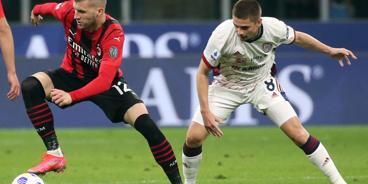 Cagliari's Razvan Marin challenges Milan's Ante Rebic