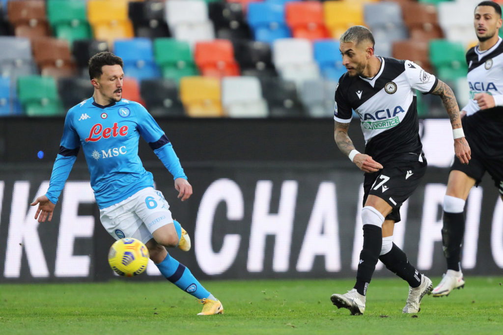 Roberto Pereyra (R) and Napoli?s Mario Rui in action during the Italian Serie A match Udinese Calcio vs Napoli