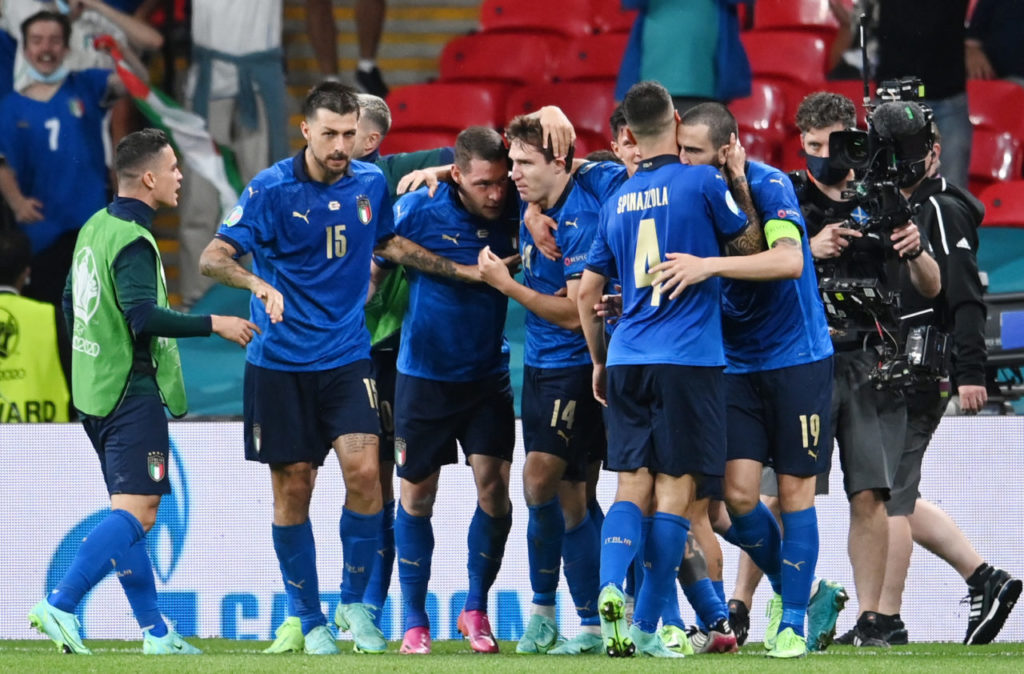 Federico Chiesa (C) of Italy celebrates with team-mates after scoring the 1-0 goal against Austria.