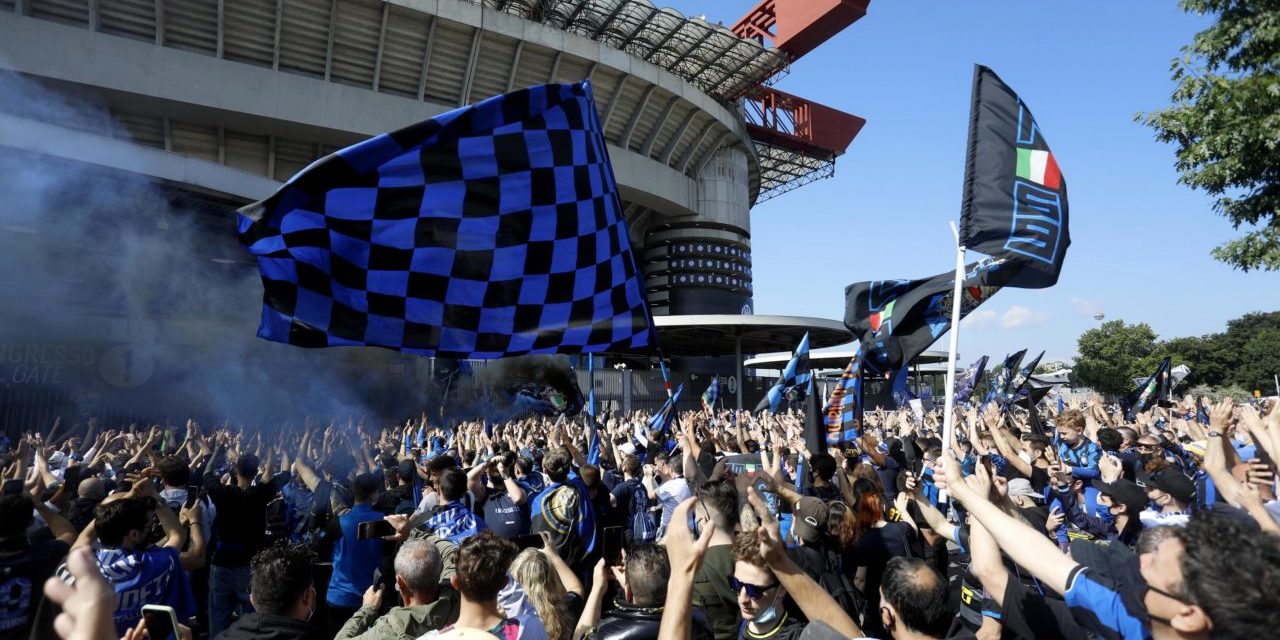Inter fans celebrate their 19th Serie A title outside the stadio Giuseppe Meazza