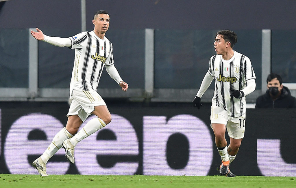 epa08917621 Juventus? Cristiano Ronaldo (L) celebrates with his teammate Paulo Dybala after scoring the the 1-0 goal during the Italian Serie A soccer match Juventus FC vs Udinese Calcio at the Allianz Stadium in Turin, Italy, 03 January 2021. EPA-EFE/ALESSANDRO DI MARCO