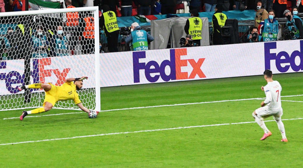 Alvaro Morato of Spain fails to convert his penalty against goalkeeper Gianluigi Donnarumma of Italy during the penalty shoot-out of the UEFA EURO 2020 semi final between Italy and Spain in London