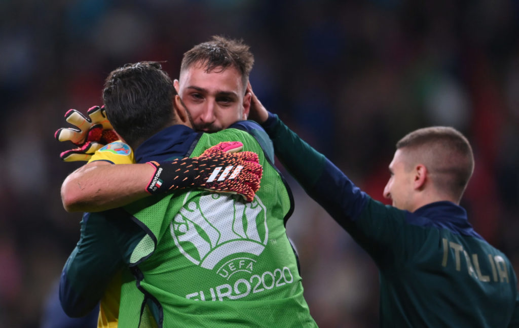 Gianluigi Donnarumma (C) of Italy celebrates winning the penalty shoot-out of the UEFA EURO 2020 semi final between Italy and Spain in London