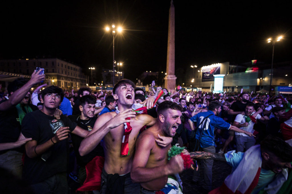 Italy fans cheer on their team as they watch the UEFA EURO 2020 semi final match between Italy and Spain at a public viewing in Piazza del Popolo, Rome
