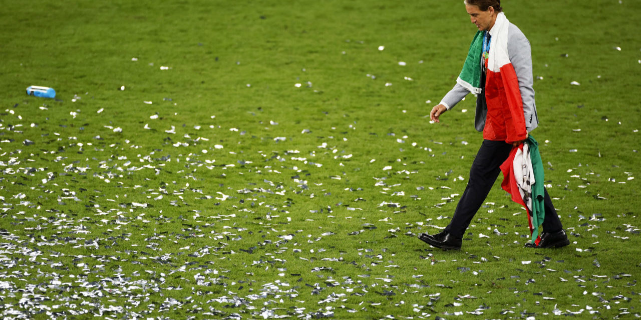 Head coach of Italy Roberto Mancini is wrapped in the Italian flag after the UEFA EURO 2020 final between Italy and England in London, Britain, 11 July 2021. Italy won the game in penalty shoot-out.
