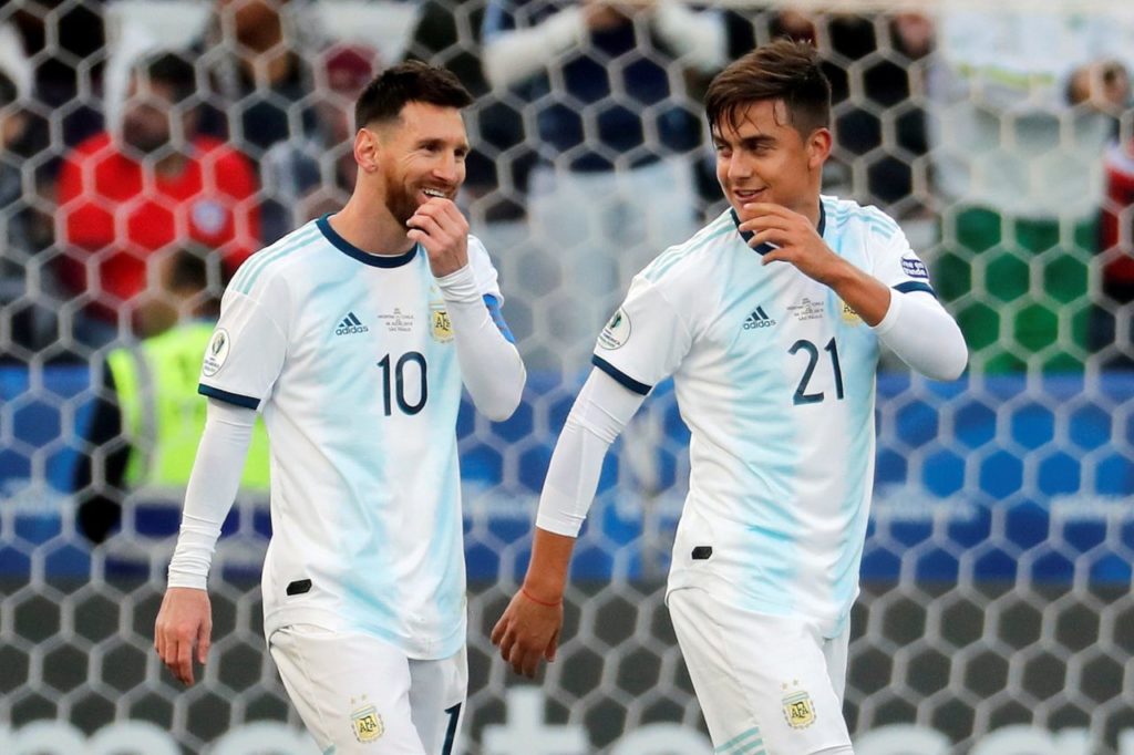 epa07699981 Argentine Paulo Dybala celebrates with teammate Lionel Messi (L) after scoring, during the Copa America 2019 3rd place soccer match between Argentina and Chile, at Arena Corinthians Stadium in Sao Paulo, Brazil, 06 July 2019. EPA-EFE/Paulo Whitaker