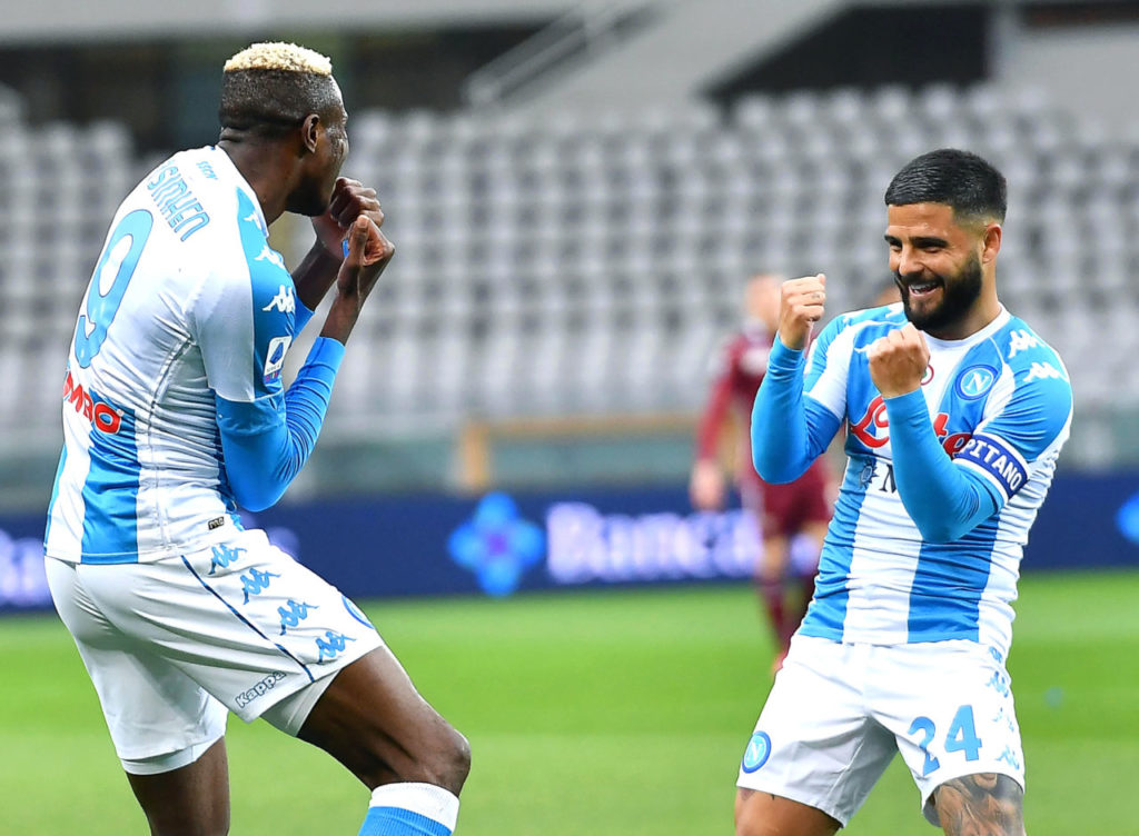 epa09162263 Napoli's Victor Osimhen (L) celebrates with teammate Lorenzo Insigne (R) after scoring the 2-0 lead during the Italian Serie A soccer match between Torino FC and SSC Napoli at the Olimpico Grande Torino stadium in Turin, Italy, 26 April 2021. EPA-EFE/ALESSANDRO DI MARCO