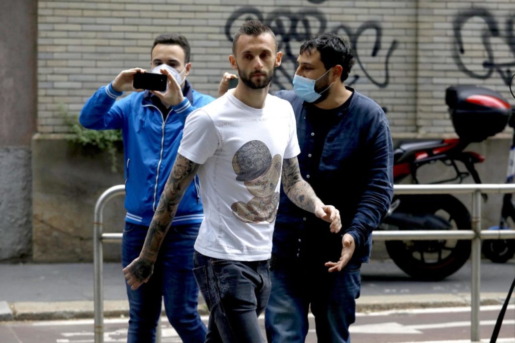 epa09212440 Player Marcelo Brozovic leaves the restaurant where the FC Inter players celebrated the victory of the Scudetto (winning the Soccer Championship), Milan, Italy, 19 May 2021. EPA-EFE/Mourad Balti Touati
