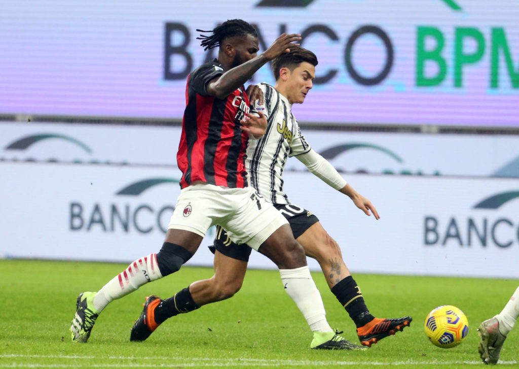 epa08923352 Milan's Franck Kessie (L) challenges for the ball Juventus' Paulo Dybala during the Italian serie A soccer match between Ac Milan and Juventus FC at Giuseppe Meazza stadium in Milan, Italy, 06 January 2021. EPA-EFE/MATTEO BAZZI