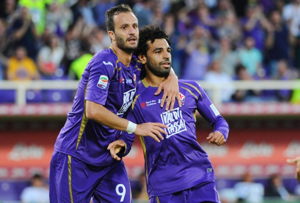 epa04755724 Fiorentina's forward Mohamed Salah (R) celebrates with teammate Alberto Gilardino after scoring the third goal of the Italian Serie A soccer match between ACF Fiorentina and FC Parma at Artemio Franchi Stadium in Florence, Italy, 18 May 2015. EPA/MAURIZIO DEGL' INNOCENTI