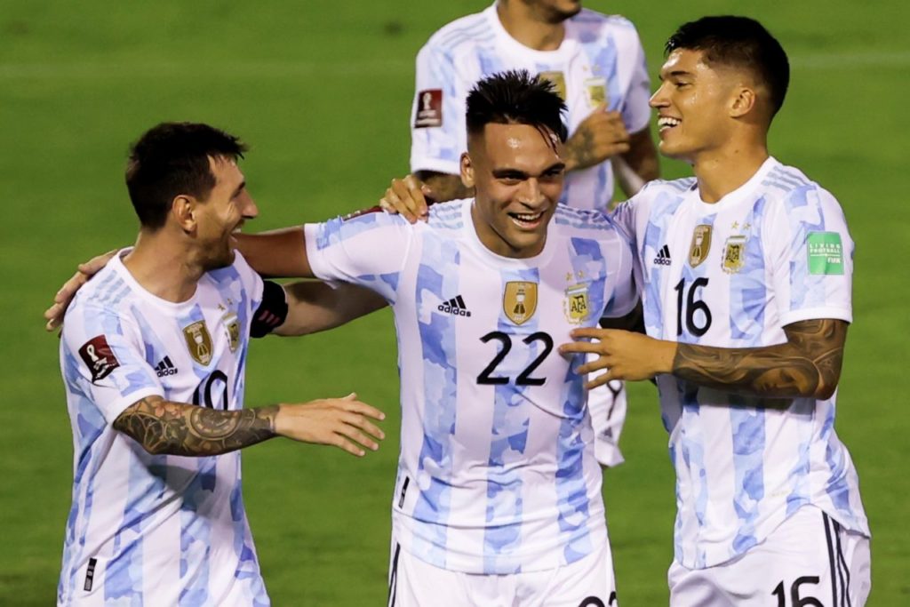 epa09444462 Argentina's Lautaro Martinez (C) celebrates with his teammates Lionel Messi (L) and Joaquin Correa (R) after scoring against Venezuela, during the Conmebol qualifiers for the Qatar 2022 World Cup between Venezuela and Argentina, in Caracas, Venezuela, 02 September 2021. EPA-EFE/Miguel Gutierrez / POOL