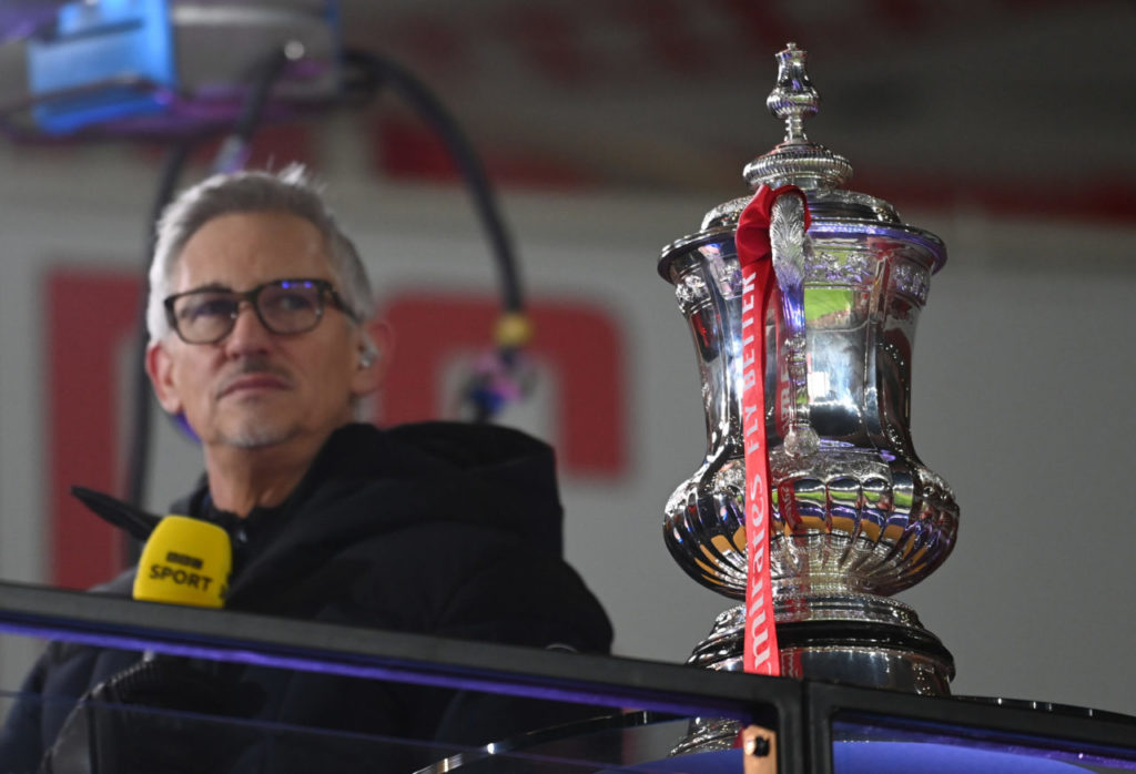 epa08928864 English former striker Gary Lineker next to the FA Cup trophy prior to the English FA Cup third round soccer match between Arsenal and Newcastle United in London, Britain, 09 January 2021. EPA-EFE/ANDY RAIN EDITORIAL USE ONLY. No use with unauthorized audio, video, data, fixture lists, club/league logos or 'live' services. Online in-match use limited to 120 images, no video emulation. No use in betting, games or single club/league/player publications.