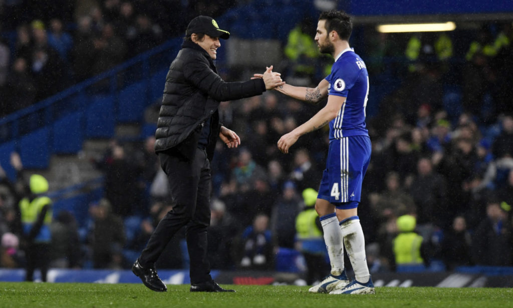 epa05814979 Chelsea manager Antonio Conte (L) greets player Cesc Fabregas (R) at the end of the English Premier League soccer match Chelsea vs Swansea at Stamford Bridge, London, Britain, 25 February 2017. EPA/WILL OLIVER EDITORIAL USE ONLY. No use with unauthorized audio, video, data, fixture lists, club/league logos or 'live' services. Online in-match use limited to 75 images, no video emulation. No use in betting, games or single club/league/player publications