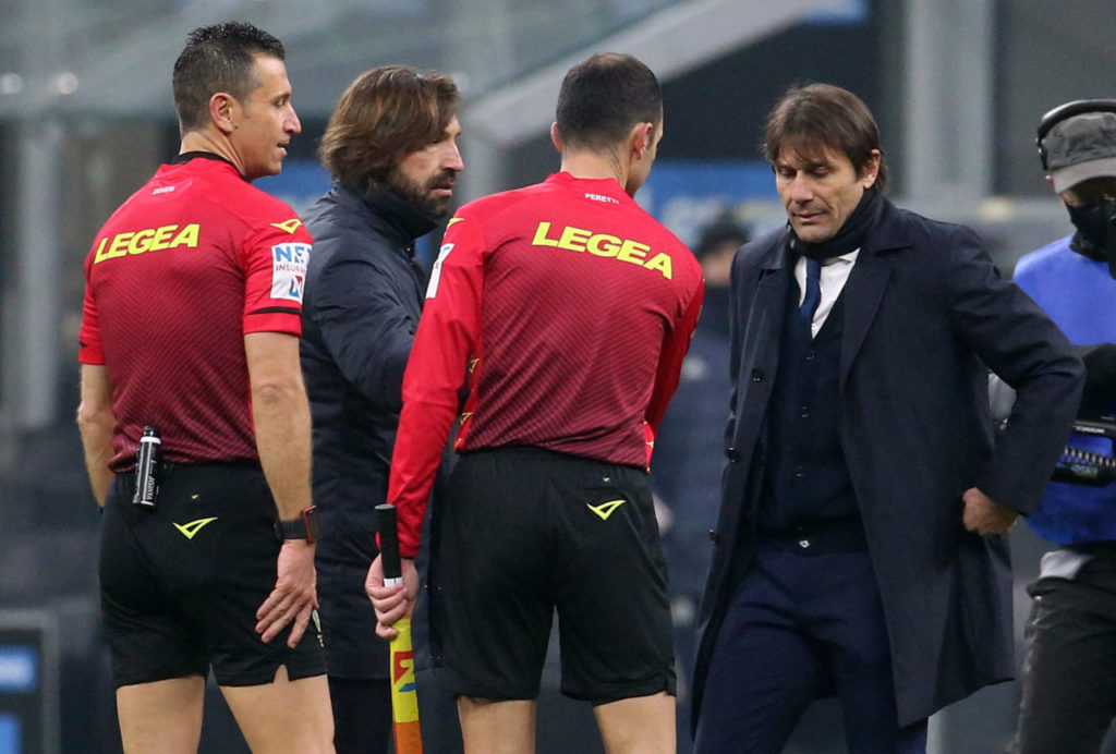 epa08944932 Juventus' head coach Andrea Pirlo (2-L) and Inter's coach Antonio Conte (R) during the Italian Serie A soccer match between FC Inter and Juventus FC at Giuseppe Meazza stadium in Milan, Italy, 17 January 2021. EPA-EFE/MATTEO BAZZI