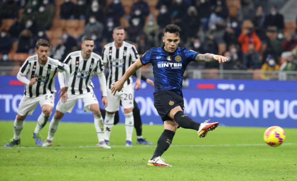epa09681325 Inter Milan's Lautaro Martinez scores the 1-1 penalty goal during the Italian Supercup match between FC Inter and Juventus FC at Giuseppe Meazza stadium in Milan, Italy 12 January 2022. EPA-EFE/MATTEO BAZZI