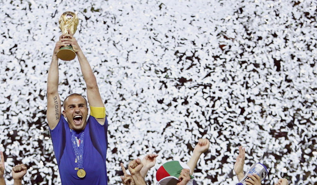 epa01891378 (FILES) Italian captain Fabio Cannavaro raises the FIFA World Cup trophy after Italy won the final of the 2006 FIFA World Cup against France at the Olympic Stadium in Berlin, Germany, late Sunday 09 July 2006. Italy?s national team captain Fabio Cannavaro failed a drug test in September but could escape sanction as an anti-allergy treatment could have caused him to test positive. Italian media reported late 08 October 2009 that Juventus, which Cannavaro joined in the summer, alerted the National Olympic committee (CONI) that the veteran defender, 36, had been treated with a cortisone injection after being stung by a hornet. EPA/Daniel Dal Zennaro