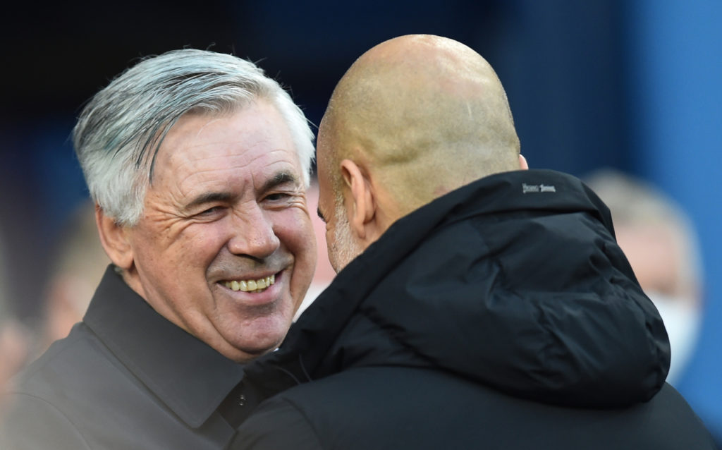 Real Madrid manager Carlo Ancelotti (L) greets his opponent Manchester City manager Pep Guardiola (R) before the UEFA Champions League semi final, first leg soccer match between Manchester City and Real Madrid in Manchester, Britain, 26 April 2022. EPA-EFE/PETER POWELL