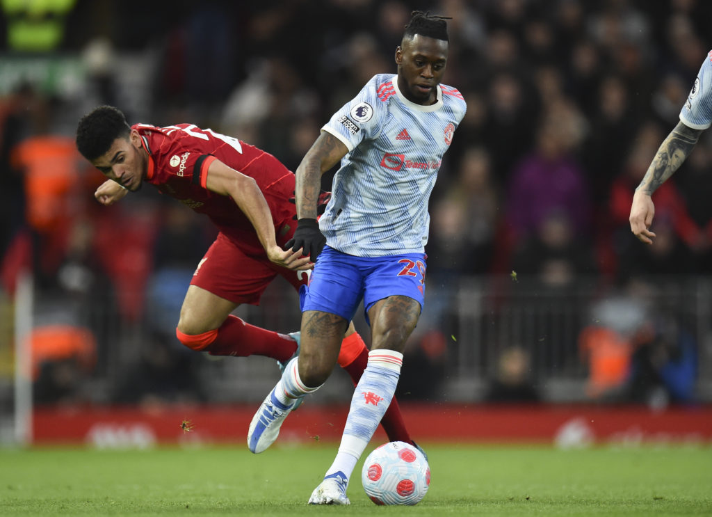 epa09897684 Luis Diaz (L) of Liverpool in action against Aaron Wan-Bissaka (R) of Manchester United during the English Premier League soccer match between Liverpool and Manchester United in Liverpool, Britain, 19 April 2022. EPA-EFE/PETER POWELL EDITORIAL USE ONLY. No use with unauthorized audio, video, data, fixture lists, club/league logos or 'live' services. Online in-match use limited to 120 images, no video emulation. No use in betting, games or single club/league/player publications