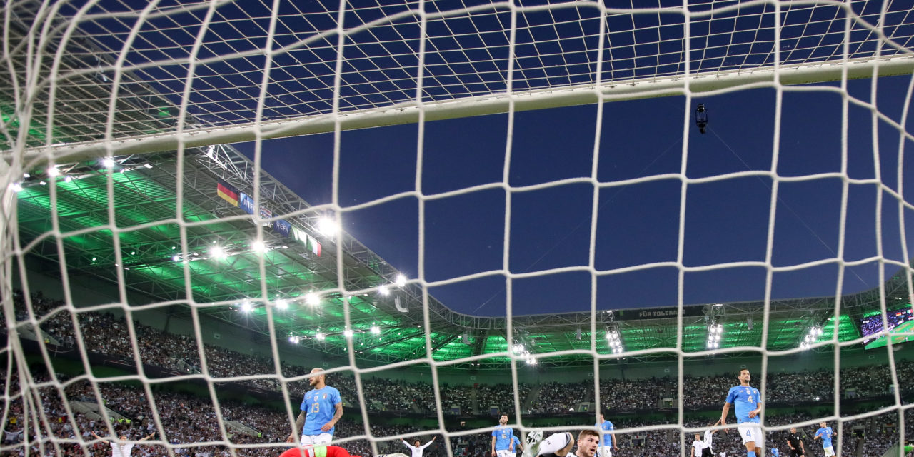 epa10013502 Italy's goalkeeper Gianluigi Donnarumma (front L) concedes a goal by Timo Werner (front R) of Germany during the UEFA Nations League soccer match between Germany and Italy in Moenchengladbach, Germany, 14 June 2022. EPA-EFE/Friedemann Vogel