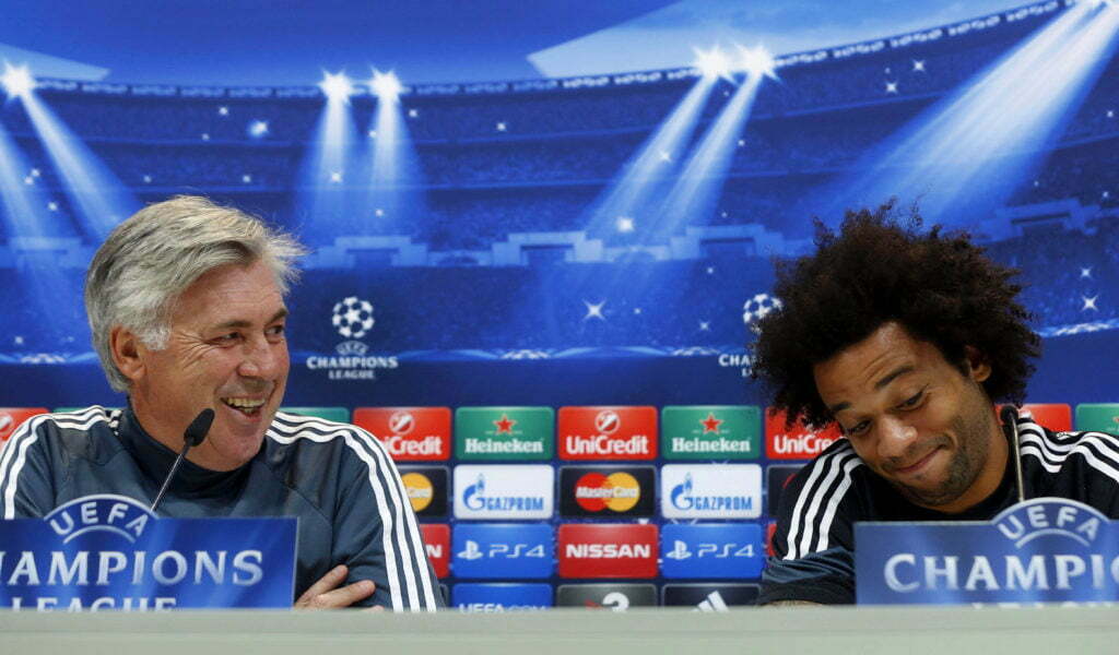epa04474589 Real Madrid's Italian head coach Carlo Ancelotti (L) and Brazilian defender Marcelo (R) attend a press conference in Madrid, Spain, 03 November 2014. Real Madrid will face Liverpool FC in the UEFA Champions League group B soccer match at the Santiago Bernabeu Stadium in Madrid on 04 November 2014. EPA/JUAN CARLOS HIDALGO
