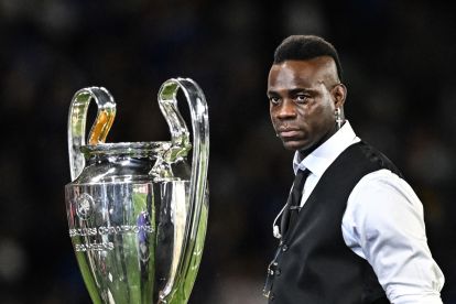 Former Inter Milan player Mario Balotelli, working as a pundit for BT Sport, stands with the European Cup ahead of the UEFA Champions League final football match between Inter Milan and Manchester City at the Ataturk Olympic Stadium in Istanbul, on June 10, 2023. (Photo by Paul ELLIS / AFP) (Photo by PAUL ELLIS/AFP via Getty Images)