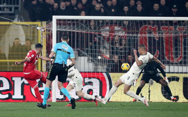 MONZA, ITALY - FEBRUARY 18: Dany Mota of AC Monza scores his team's second goal whilst under pressure from Alessandro Florenzi and Malick Thiaw of AC Milan during the Serie A TIM match between AC Monza and AC Milan - Serie A TIM at U-Power Stadium on February 18, 2024 in Monza, Italy. (Photo by Marco Luzzani/Getty Images)