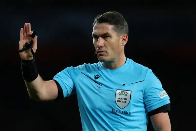 Romanian referee Istvan Kovacs gestures during the UEFA Champions League Group B football match between Arsenal and Sevilla at the Emirates Stadium in north London on November 8, 2023. (Photo by Adrian DENNIS / AFP) (Photo by ADRIAN DENNIS/AFP via Getty Images)