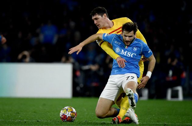 TOPSHOT - Napoli's Georgian forward #77 Khvicha Kvaratskhelia (R) vies with Barcelona's Danish defender #15 Andreas Christensen (L) during the UEFA Champions League round of 16 first Leg football match between Napoli and Barcelona, coached by Xavi, at the Diego-Armando-Maradona stadium in Naples on February 21, 2024. (Photo by Filippo MONTEFORTE / AFP) (Photo by FILIPPO MONTEFORTE/AFP via Getty Images)