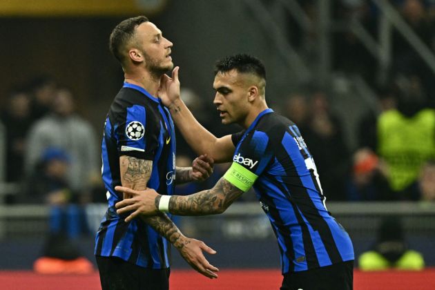 Atletico Madrid's Spanish midfielder #08 Saul Niguez is comforted by teammate Inter Milan's Argentine forward #10 Lautaro Martinez after missing a shot during the UEFA Champions League last 16 first leg football match Inter Milan vs Atletico Madrid at the San Siro stadium in Milan on February 20, 2024. (Photo by GABRIEL BOUYS / AFP) (Photo by GABRIEL BOUYS/AFP via Getty Images)