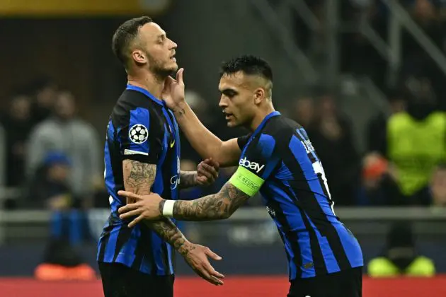 Atletico Madrid's Spanish midfielder #08 Saul Niguez is comforted by teammate Inter Milan's Argentine forward #10 Lautaro Martinez after missing a shot during the UEFA Champions League last 16 first leg football match Inter Milan vs Atletico Madrid at the San Siro stadium in Milan on February 20, 2024. (Photo by GABRIEL BOUYS / AFP) (Photo by GABRIEL BOUYS/AFP via Getty Images)