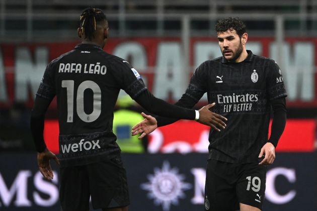 AC Milan defender Theo Hernandez (R) shakes hands with AC Milan forward Rafael Leao (L) as he celebrates scoring AC Milan's first goal during the Italian Serie A football match between AC Milan and Napoli at the San Siro Stadium, in Milan on February 11, 2024, wearing the Milan Pleasures kit. (Photo by Isabella BONOTTO / AFP) (Photo by ISABELLA BONOTTO/AFP via Getty Images)