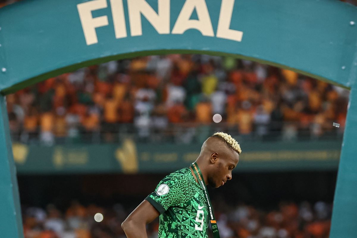Nigeria forward Victor Osimhen reacts on the podium after losing at the end of the Africa Cup of Nations (CAN) 2024 final football match between Ivory Coast and Nigeria at Alassane Ouattara Olympic Stadium in Ebimpe, Abidjan on February 11, 2024. (Photo by FRANCK FIFE / AFP) (Photo by FRANCK FIFE/AFP via Getty Images)