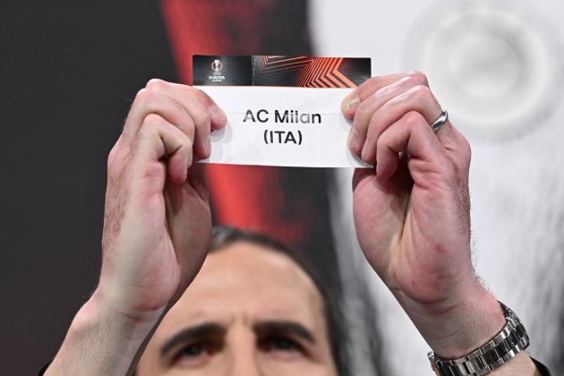 Irish former football international John O'Shea holds up the paper slip of AC Milan during the draw for the round of 16 of the 2023-2024 UEFA Europa League football tournament at the House of European Football in Nyon, on February 23, 2024. (Photo by Fabrice COFFRINI / AFP) (Photo by FABRICE COFFRINI/AFP via Getty Images)