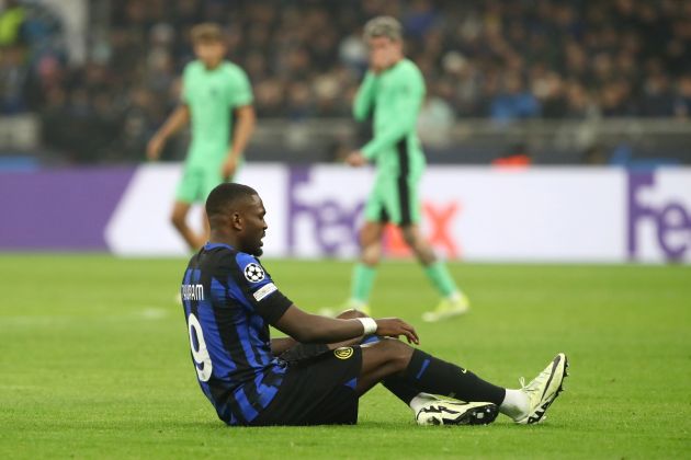 MILAN, ITALY - FEBRUARY 20: Marcus Thuram of FC Internazionale goes down with an injury during the UEFA Champions League 2023/24 round of 16 first leg match between FC Internazionale and Atletico Madrid at Stadio Giuseppe Meazza on February 20, 2024 in Milan, Italy. (Photo by Marco Luzzani/Getty Images)