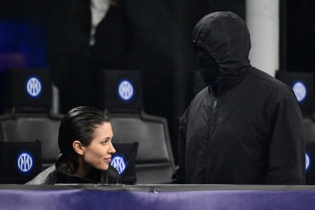 TOPSHOT - US rapper Kanye West (R) and girlfriend Bianca Censori are seen in the stands during the UEFA Champions League last 16 first leg football match Inter Milan vs Atletico Madrid at the San Siro stadium in Milan on February 20, 2024. (Photo by Marco BERTORELLO / AFP) (Photo by MARCO BERTORELLO/AFP via Getty Images)