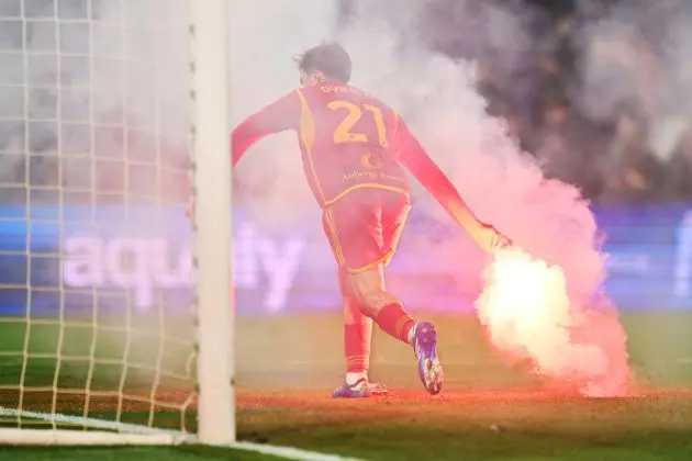 REGGIO NELL'EMILIA, ITALY - DECEMBER 03: Paulo Dybala of AS Roma removes a flare from the pitch during the Serie A TIM match between US Sassuolo and AS Roma at Mapei Stadium - Citta' del Tricolore on December 03, 2023 in Reggio nell'Emilia, Italy. (Photo by Alessandro Sabattini/Getty Images)