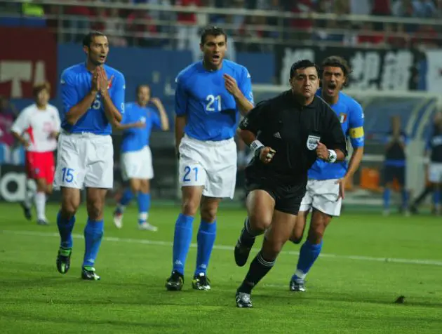 DAEJEON - JUNE 18: (From left to right) Mark Iuliano, Christian Vieri and captain Paolo Maldini of Italy complain to referee Byron Moreno of Ecuador during the FIFA World Cup Finals 2002 Second Round match between South Korea and Italy played at the Daejeon World Cup Stadium, in Daejeon, South Korea on June 18, 2002. South Korea won the match 2-1 with a Golden Goal in extra-time. DIGITAL IMAGE. (Photo by Ben Radford/Getty Images)