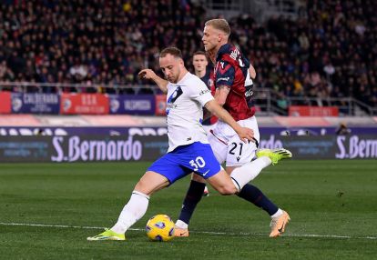 BOLOGNA, ITALY - MARCH 09: Carlos Augusto of FC Internazionale shoots under pressure from Jens Odgaard of Bologna FC during the Serie A TIM match between Bologna FC and FC Internazionale at Stadio Renato Dall'Ara on March 09, 2024 in Bologna, Italy. (Photo by Alessandro Sabattini/Getty Images)