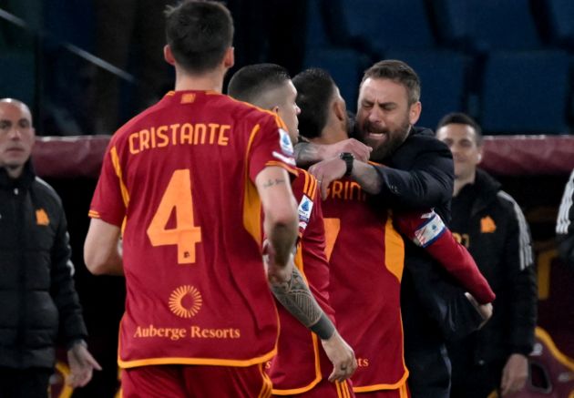 Roma's Italian midfielder #07 Lorenzo Pellegrini celebrates with Roma's Italian coach Daniele De Rossi (R) after scoring a goal during the Italian Serie A football math between AS Roma and Sassuolo at the Olympic stadium in Rome on March 17, 2024. (Photo by tiziana fabi / AFP) (Photo by TIZIANA FABI/AFP via Getty Images)