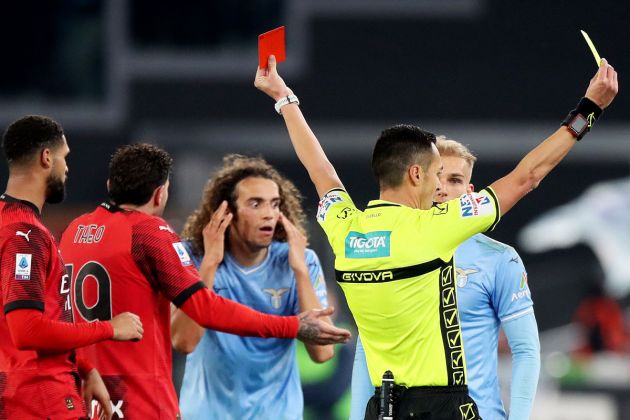 ROME, ITALY - MARCH 01: Referee Marco Di Bello shows a red card to Matteo Guendouzi of SS Lazio as Christian Pulisic of AC Milan is shown a yellow card during the Serie A TIM match between SS Lazio and AC Milan - Serie A TIM at Stadio Olimpico on March 01, 2024 in Rome, Italy. (Photo by Paolo Bruno/Getty Images)