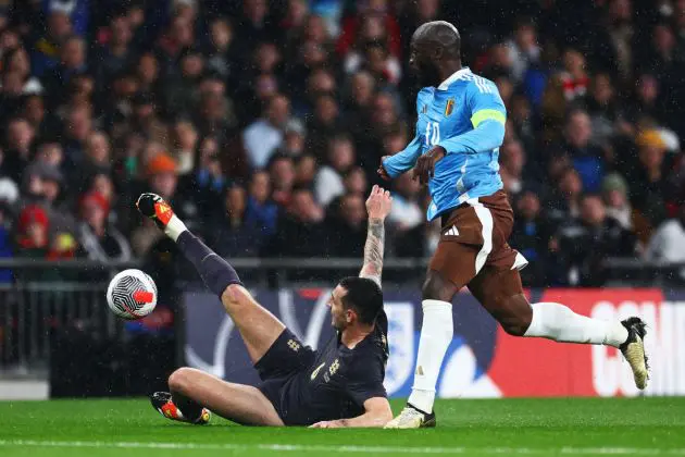 LONDON, ENGLAND - MARCH 26: Lewis Dunk of England makes an error which Romelu Lukaku of Belgium latches on to, later assisting his teammate Youri Tielemans (not pictured), who scores their team's second goal during the international friendly match between England and Belgium at Wembley Stadium on March 26, 2024 in London, England. (Photo by Clive Rose/Getty Images)