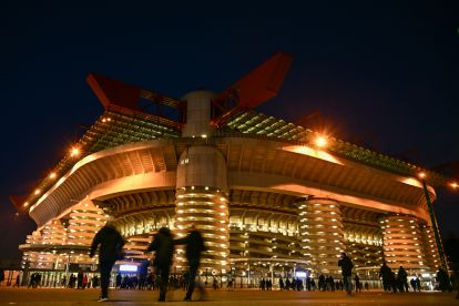 Pedestrians walk by San Siro Stadium prior to the Italian Serie A football match between Inter Milan and Genoa, in Milan on March 4, 2024. (Photo by GABRIEL BOUYS / AFP) (Photo by GABRIEL BOUYS/AFP via Getty Images) (Champions League night)