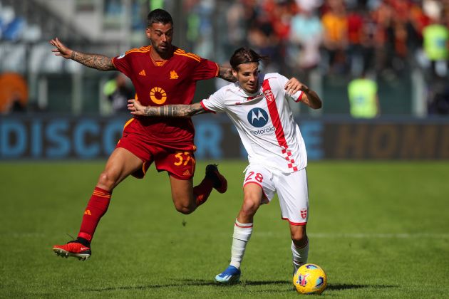 ROME, ITALY - OCTOBER 22: Andrea Colpani of AC Monza battles for possession with Leonardo Spinazzola of AS Roma during the Serie A TIM match between AS Roma and AC Monza at Stadio Olimpico on October 22, 2023 in Rome, Italy. (Photo by Paolo Bruno/Getty Images)