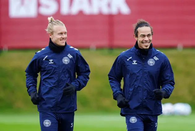 Denmark defender Simon Kjaer (L) and Denmark's forward Yussuf Poulsen warm up during a training session of Denmark's national football team in Helsingoer, Denmark on March 21, 2024, ahead of the friendly football match against Switzerland. (Photo by Liselotte Sabroe / Ritzau Scanpix / AFP) / Denmark OUT (Photo by LISELOTTE SABROE/Ritzau Scanpix/AFP via Getty Images)