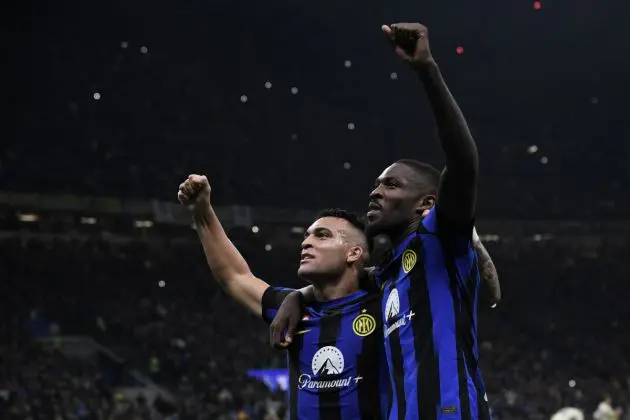 TOPSHOT - Inter Milan forward Marcus Thuram (R) celebrates with teammate Inter Milan forward Lautaro Martinez after scoring the team's first goal during the Italian Serie A football match between Inter Milan and AS Roma at San Siro Stadium, in Milan on October 29, 2023. (Photo by Isabella BONOTTO / AFP) (Photo by ISABELLA BONOTTO/AFP via Getty Images)