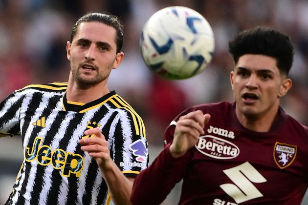 Juventus' French midfielder #25 Adrien Rabiot (L) looks the ball during the Italian Serie A football match between Torino and Juventus at the Grande Torino Stadium in Turin on April 13, 2024. (Photo by MARCO BERTORELLO / AFP) (Photo by MARCO BERTORELLO/AFP via Getty Images)