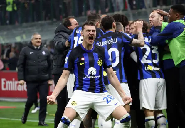 MILAN, ITALY - APRIL 22: Benjamin Pavard of FC Internazionale celebrates his team's second goal scored by Marcus Thuram (not pictured) during the Serie A TIM match between AC Milan and FC Internazionale at Stadio Giuseppe Meazza on April 22, 2024 in Milan, Italy. (Photo by Marco Luzzani/Getty Images)