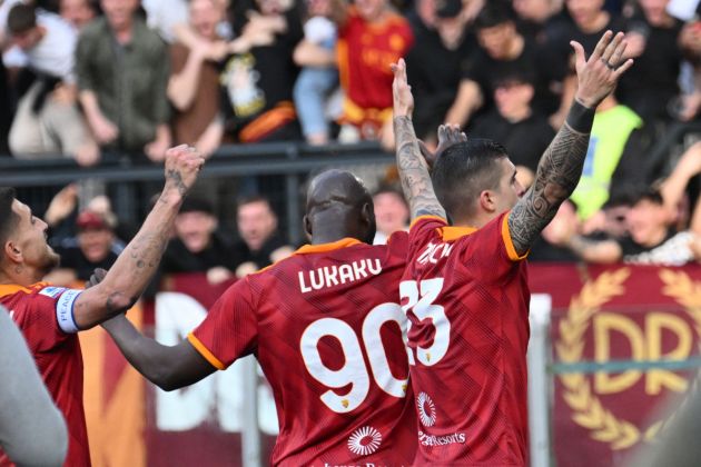 Roma's Italian defender #23 Gianluca Mancini celebrates with teammate Roma's Belgian midfielder #90 Romelu Lukaku and supporters after scoring the team's first goal during the Italian Serie A football match between AS Roma and Lazio on April 6, 2024 at the Olympic stadium in Rome. (Photo by Alberto PIZZOLI / AFP) (Photo by ALBERTO PIZZOLI/AFP via Getty Images)